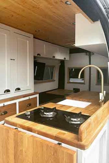 girl looking out the back of a van