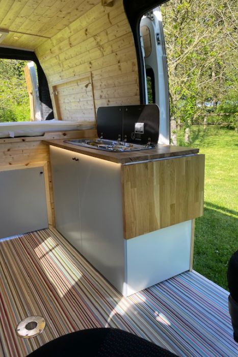 silver camper an parked on driveway